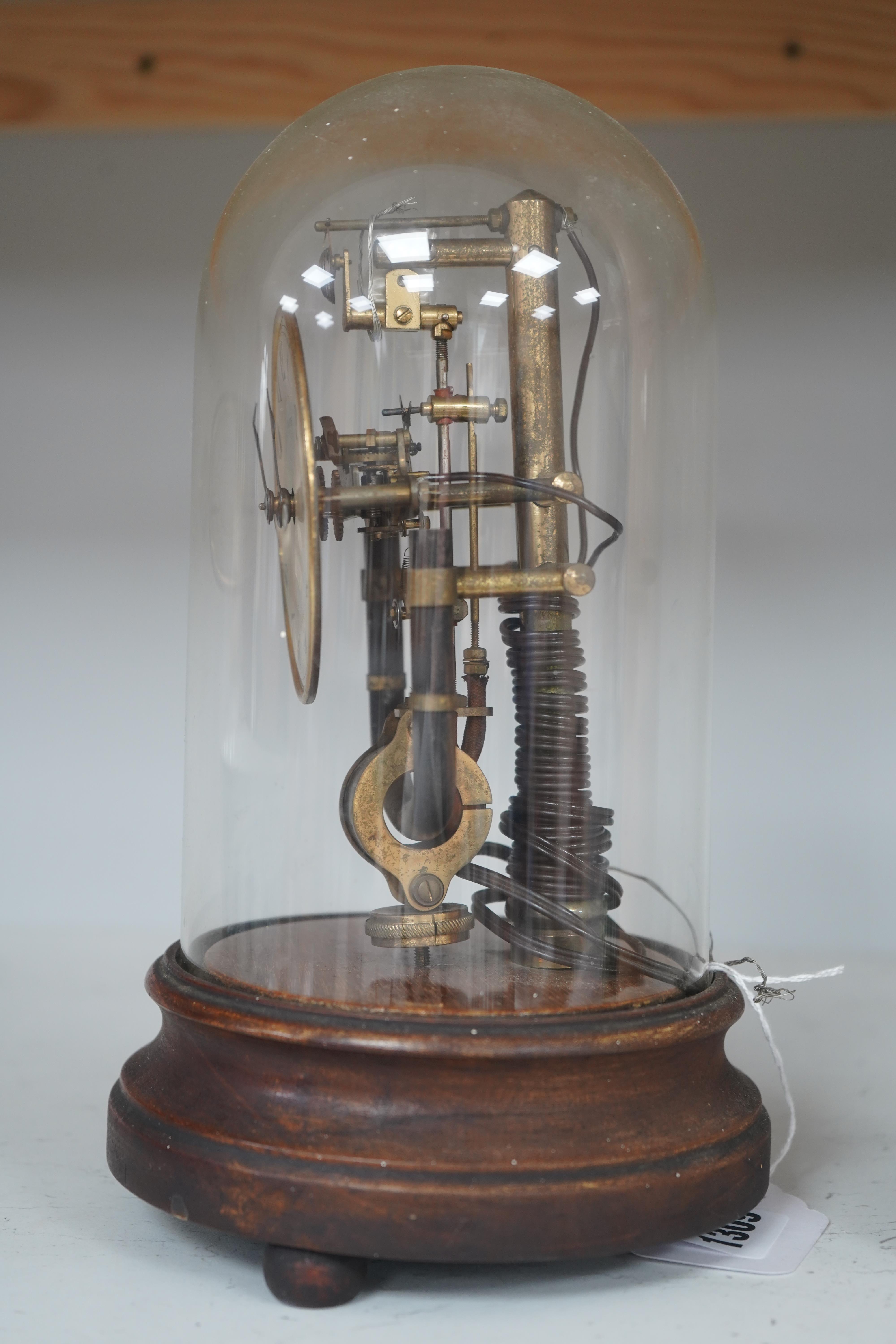 A Bulle type 800 day electric clock, under a glass dome, 26cm high. Condition - fair, untested